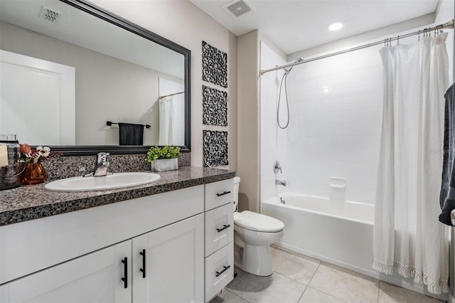 9839 Lemon Drop Loop, Sun City Center, FL 33573 - bathroom featuring vanity, shower / tub combo with curtain, tile patterned floors, and recessed lighting