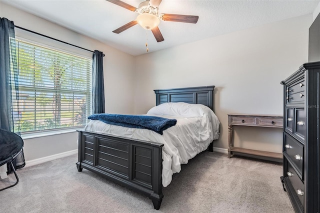 9839 Lemon Drop Loop, Sun City Center, FL 33573 - carpeted bedroom featuring multiple windows and ceiling fan