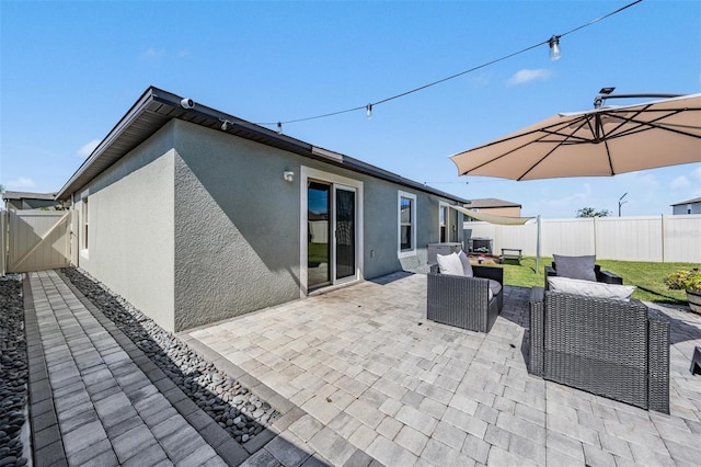 9839 Lemon Drop Loop, Sun City Center, FL 33573 - fenced backyard featuring an outdoor living space, a patio, and a gate