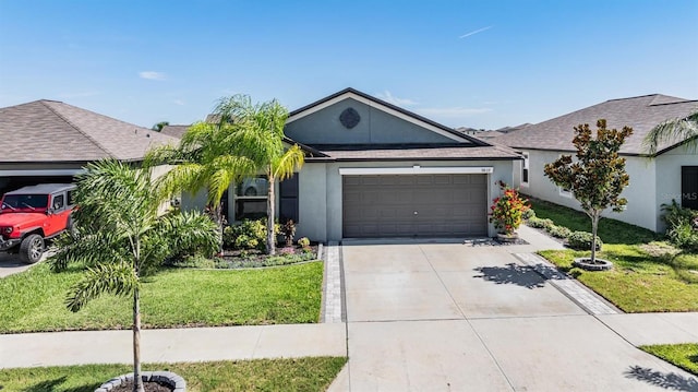 9839 Lemon Drop Loop, Sun City Center, FL 33573 - ranch-style house featuring an attached garage, driveway, a front lawn, and stucco siding