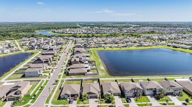 9839 Lemon Drop Loop, Sun City Center, FL 33573 - aerial perspective of suburban area featuring a large body of water
