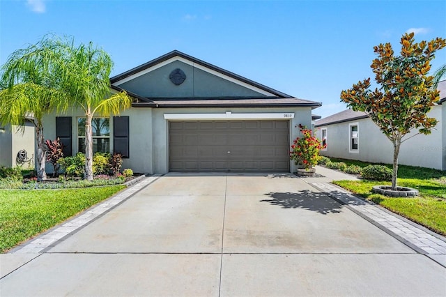 9839 Lemon Drop Loop, Sun City Center, FL 33573 - ranch-style house with stucco siding, a garage, concrete driveway, and a front lawn