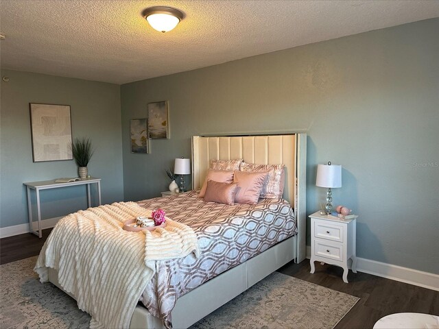 3315 58th Ave S Unit 421, Saint Petersburg, FL 33712 - bedroom featuring wood finished floors and a textured ceiling
