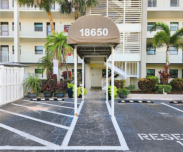 18650 Gulf Blvd Unit 314, Indian Shores, FL 33785 - view of property featuring uncovered parking