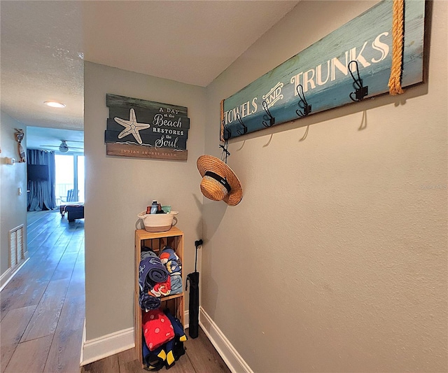 18650 Gulf Blvd Unit 314, Indian Shores, FL 33785 - hallway with wood finished floors and baseboards