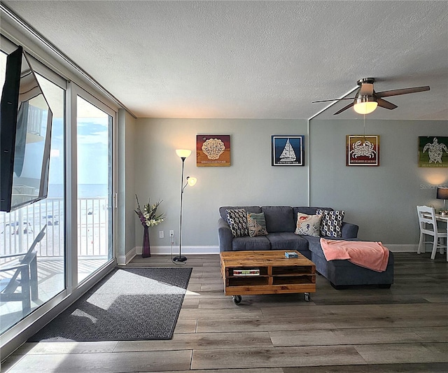 18650 Gulf Blvd Unit 314, Indian Shores, FL 33785 - living room with wood finished floors, ceiling fan, and a textured ceiling