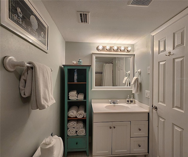 18650 Gulf Blvd Unit 314, Indian Shores, FL 33785 - full bathroom featuring vanity, a textured ceiling, and a shower with shower curtain