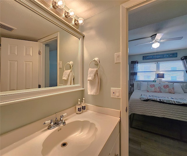 18650 Gulf Blvd Unit 314, Indian Shores, FL 33785 - bathroom with vanity, ensuite bathroom, and a ceiling fan