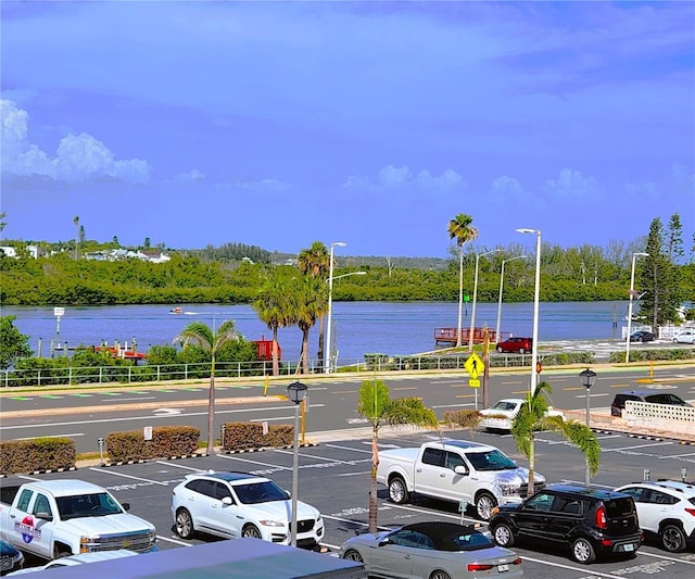 18650 Gulf Blvd Unit 314, Indian Shores, FL 33785 - uncovered parking lot with a water view