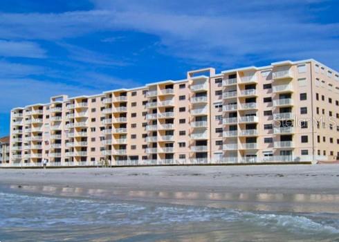 18650 Gulf Blvd Unit 314, Indian Shores, FL 33785 - view of apartment building / complex with view of water and beach