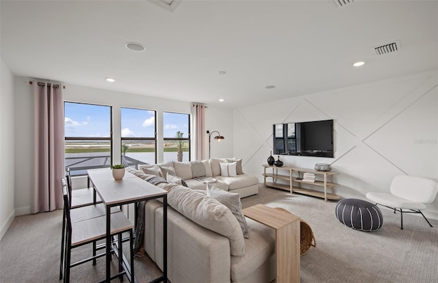 16423 Sapphire Point Dr, Lakewood Ranch, FL 34211 - living room with light colored carpet and recessed lighting