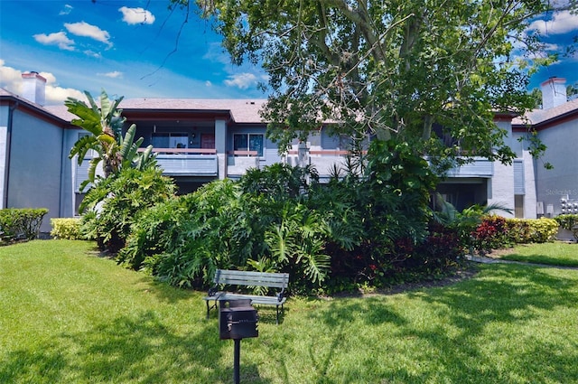 10265 Gandy Blvd N Unit 1409, Saint Petersburg, FL 33702 - view of front of home with a front yard and a balcony
