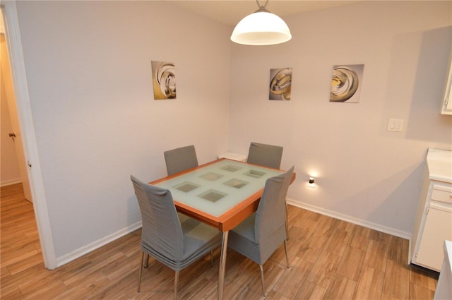 10265 Gandy Blvd N Unit 1409, Saint Petersburg, FL 33702 - dining area with light wood-style flooring and baseboards