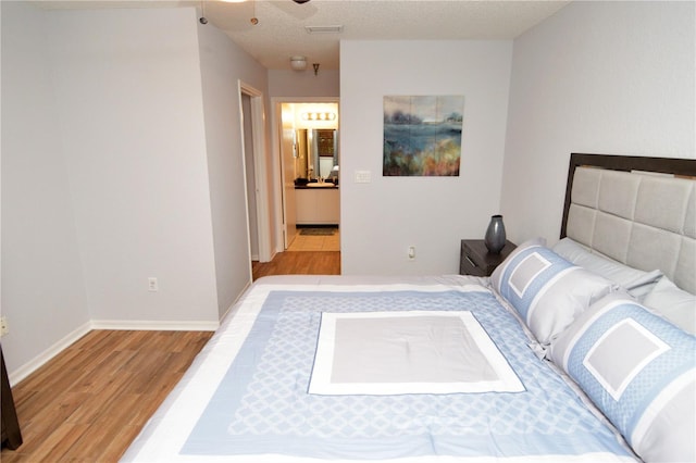 10265 Gandy Blvd N Unit 1409, Saint Petersburg, FL 33702 - bedroom featuring wood finished floors and baseboards