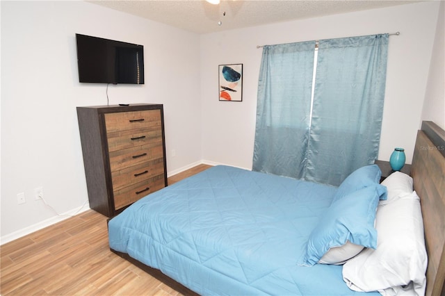 10265 Gandy Blvd N Unit 1409, Saint Petersburg, FL 33702 - bedroom featuring wood finished floors and a textured ceiling