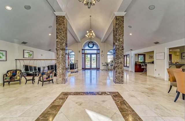 10265 Gandy Blvd N Unit 1409, Saint Petersburg, FL 33702 - foyer entrance with a chandelier, ornate columns, and high vaulted ceiling