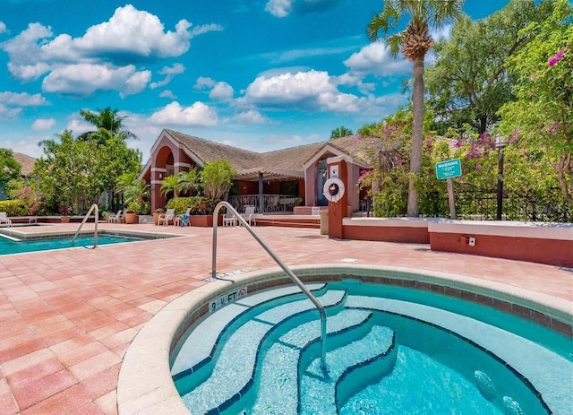 10265 Gandy Blvd N Unit 1409, Saint Petersburg, FL 33702 - community pool featuring a patio and a hot tub