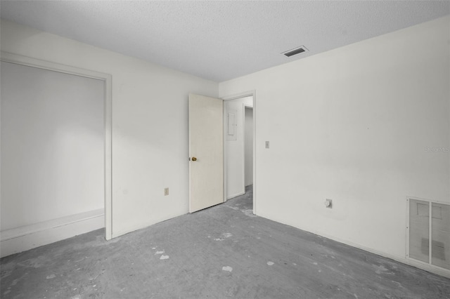 506 Duxbury Ct Unit A, Safety Harbor, FL 34695 - unfurnished bedroom featuring a textured ceiling