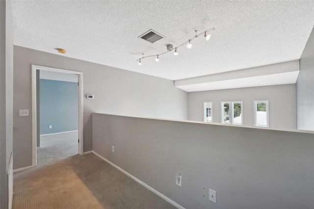 428 Klosterman Rd W, W, Palm Harbor, FL 34683 - carpeted spare room featuring a textured ceiling and a smoke detector