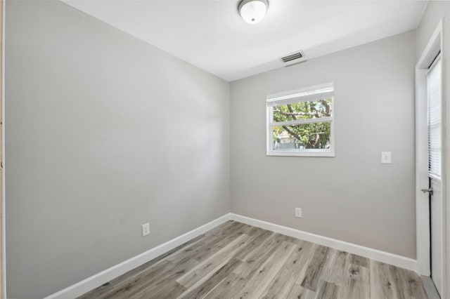 428 Klosterman Rd W, W, Palm Harbor, FL 34683 - unfurnished room featuring light wood finished floors and baseboards