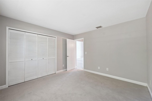 428 Klosterman Rd W, W, Palm Harbor, FL 34683 - unfurnished bedroom with carpet floors and a closet
