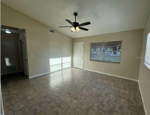 102,106,110,202,204 N Jasper Street 102,106,110,202,204, Bushnell, FL 33513 - tiled spare room featuring vaulted ceiling, a ceiling fan, and a textured ceiling