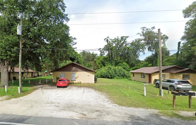 102,106,110,202,204 N Jasper Street 102,106,110,202,204, Bushnell, FL 33513 - view of front facade with a front yard and driveway