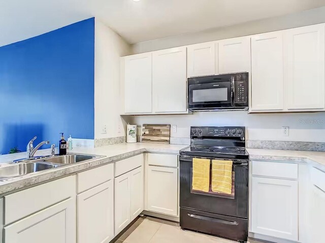 10024 Merry Fawn Ct, Sun City Center, FL 33573 - kitchen with black appliances, white cabinets, and light countertops