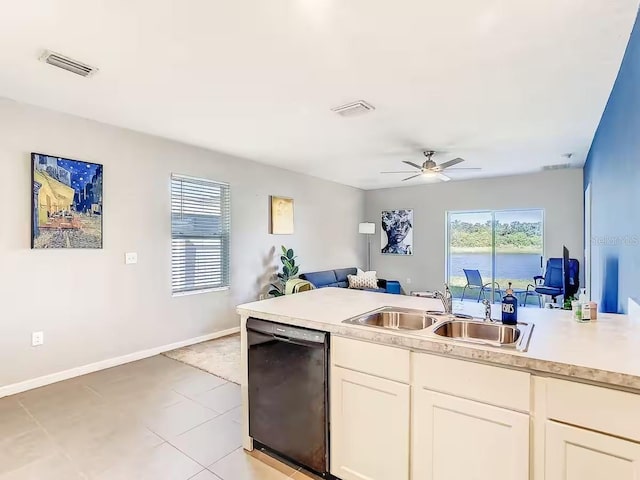 10024 Merry Fawn Ct, Sun City Center, FL 33573 - kitchen featuring black dishwasher, open floor plan, plenty of natural light, and light countertops