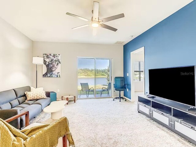 10024 Merry Fawn Ct, Sun City Center, FL 33573 - carpeted living room featuring a ceiling fan and baseboards