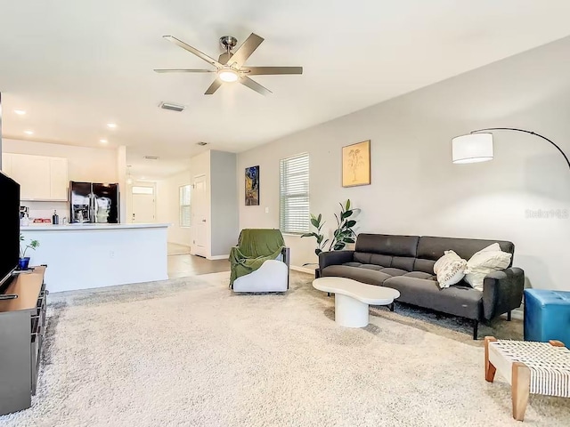 10024 Merry Fawn Ct, Sun City Center, FL 33573 - living area featuring ceiling fan, light colored carpet, and recessed lighting