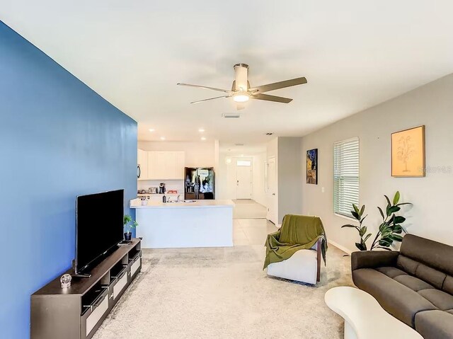 10024 Merry Fawn Ct, Sun City Center, FL 33573 - living area featuring ceiling fan and light carpet
