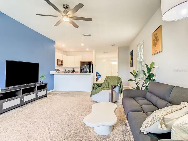 10024 Merry Fawn Ct, Sun City Center, FL 33573 - living area with ceiling fan and light carpet