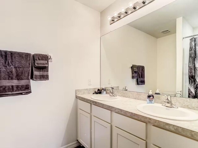 10024 Merry Fawn Ct, Sun City Center, FL 33573 - bathroom featuring double vanity