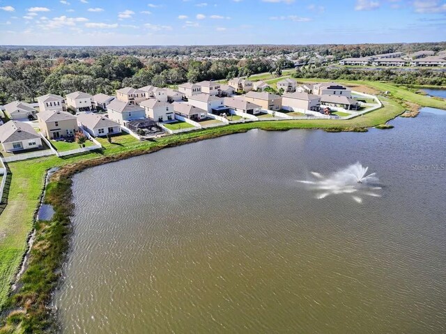10024 Merry Fawn Ct, Sun City Center, FL 33573 - aerial view of property and surrounding area with nearby suburban area and a large body of water