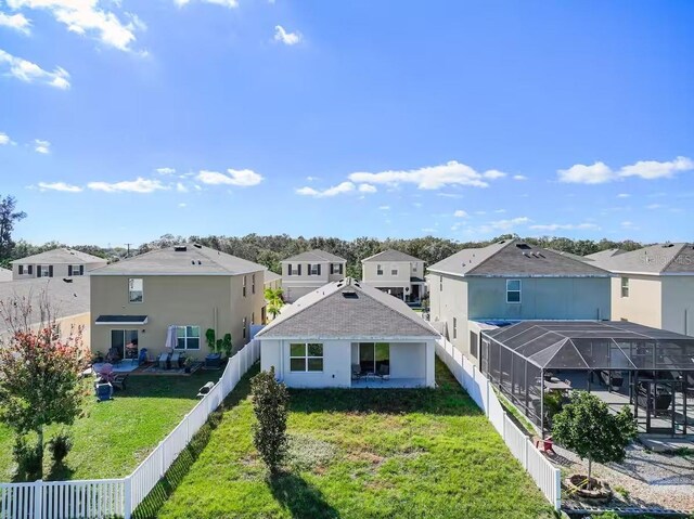 10024 Merry Fawn Ct, Sun City Center, FL 33573 - rear view of property with a residential view and a fenced backyard