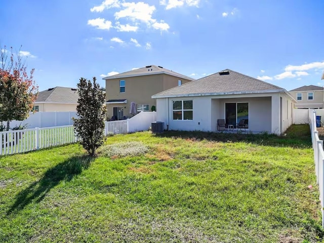 10024 Merry Fawn Ct, Sun City Center, FL 33573 - back of property featuring a fenced backyard, stucco siding, and a shingled roof