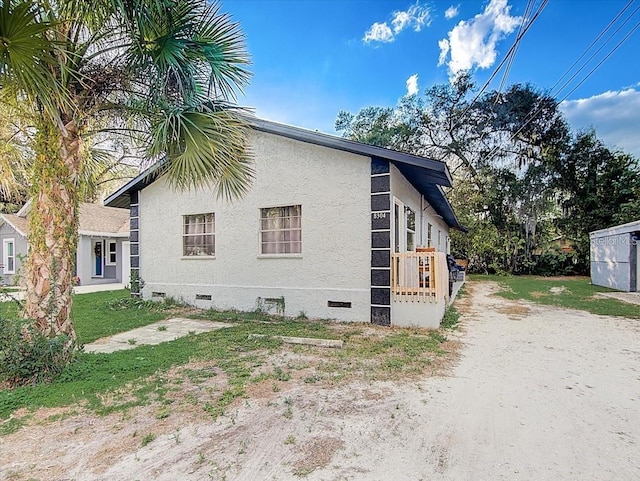 8304 N 13th St, Tampa, FL 33604 - view of side of property with crawl space and stucco siding