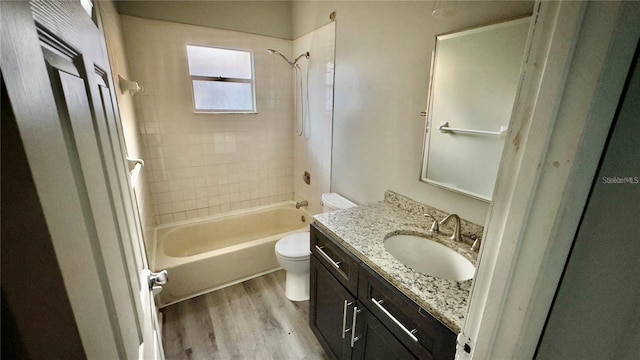 8304 N 13th St, Tampa, FL 33604 - bathroom with wood finished floors, vanity, and washtub / shower combination