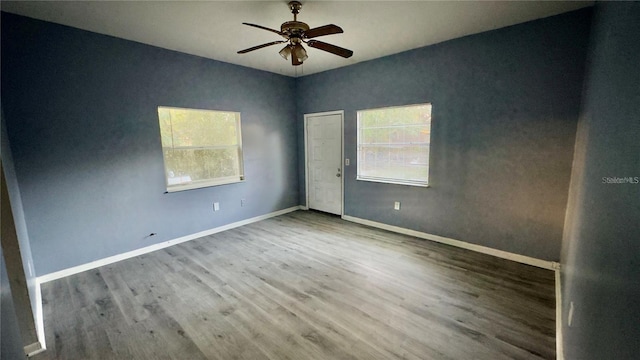 8304 N 13th St, Tampa, FL 33604 - spare room with wood finished floors and ceiling fan