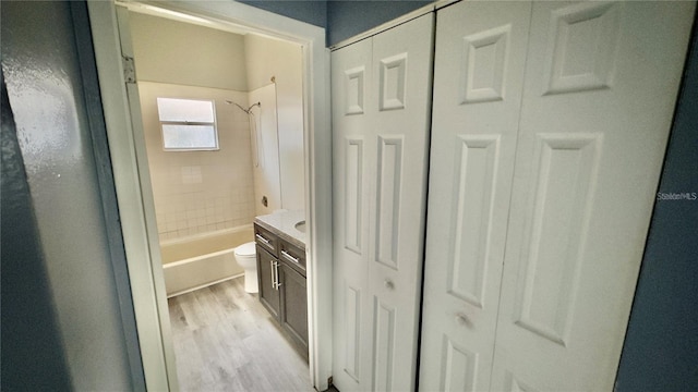 8304 N 13th St, Tampa, FL 33604 - full bath with a closet, shower / bath combination, and wood finished floors