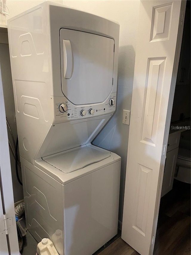 8304 N 13th St, Tampa, FL 33604 - laundry area with stacked washer / dryer and dark wood finished floors