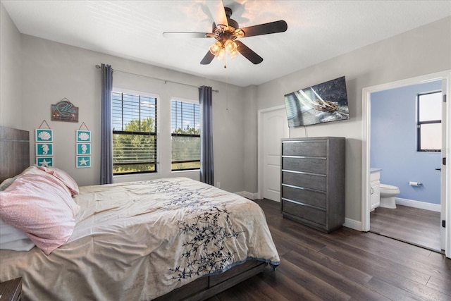 12415 Hitching St, Odessa, FL 33556 - bedroom with multiple windows, dark wood-style floors, ensuite bathroom, and a ceiling fan