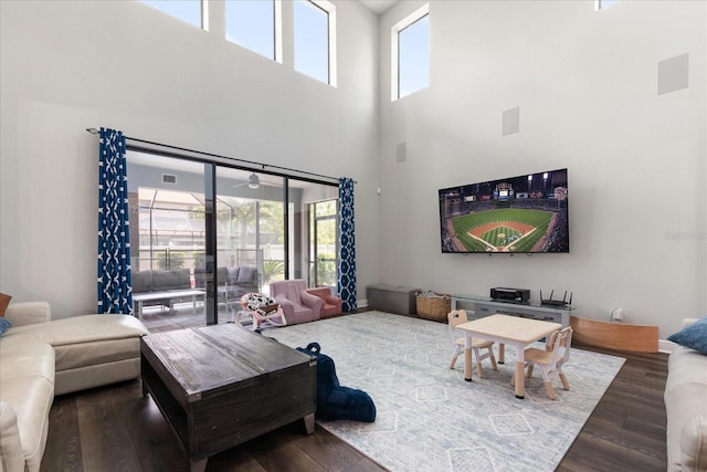 12415 Hitching St, Odessa, FL 33556 - living room featuring a high ceiling, wood finished floors, and a ceiling fan
