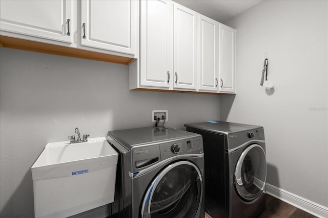 12415 Hitching St, Odessa, FL 33556 - washroom with cabinet space, separate washer and dryer, and dark wood finished floors