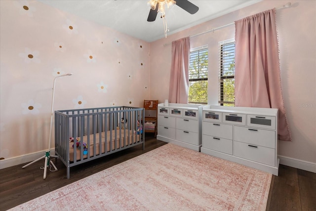 12415 Hitching St, Odessa, FL 33556 - bedroom featuring dark wood-style floors, a crib, and ceiling fan