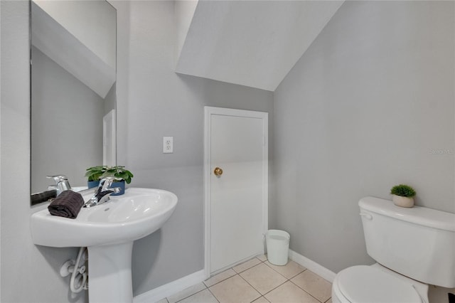 3455 Castle Stone Ct, Valrico, FL 33594 - half bathroom with tile patterned floors and vaulted ceiling