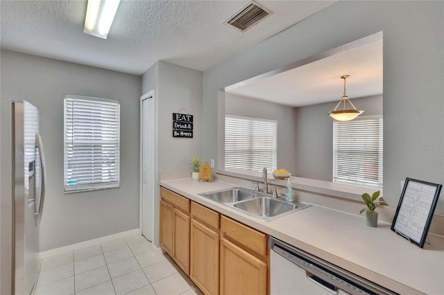 3455 Castle Stone Ct, Valrico, FL 33594 - kitchen featuring stainless steel fridge with ice dispenser, white dishwasher, a textured ceiling, light countertops, and decorative light fixtures