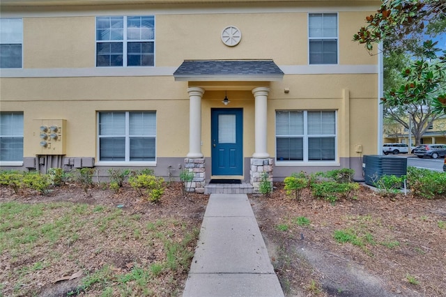 3455 Castle Stone Ct, Valrico, FL 33594 - view of front of home with stucco siding and a shingled roof