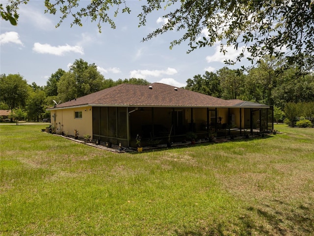 21590 SW 84th Loop, Dunnellon, FL 34431 - rear view of property featuring a sunroom and a lawn